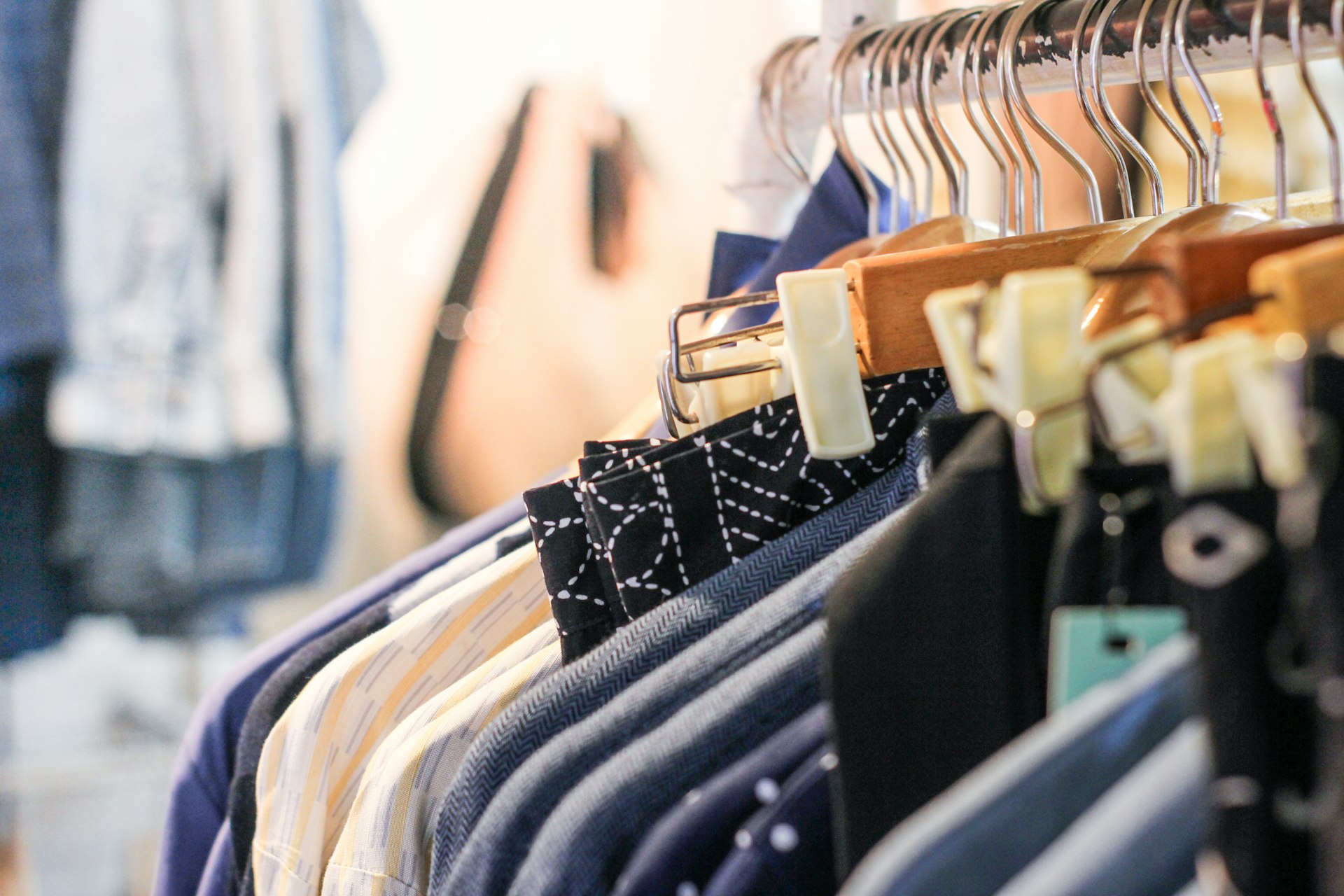 a rack of clothes hanging on a clothes rack